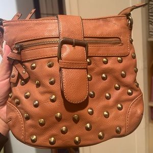 Tan crossbody bag with bronze details